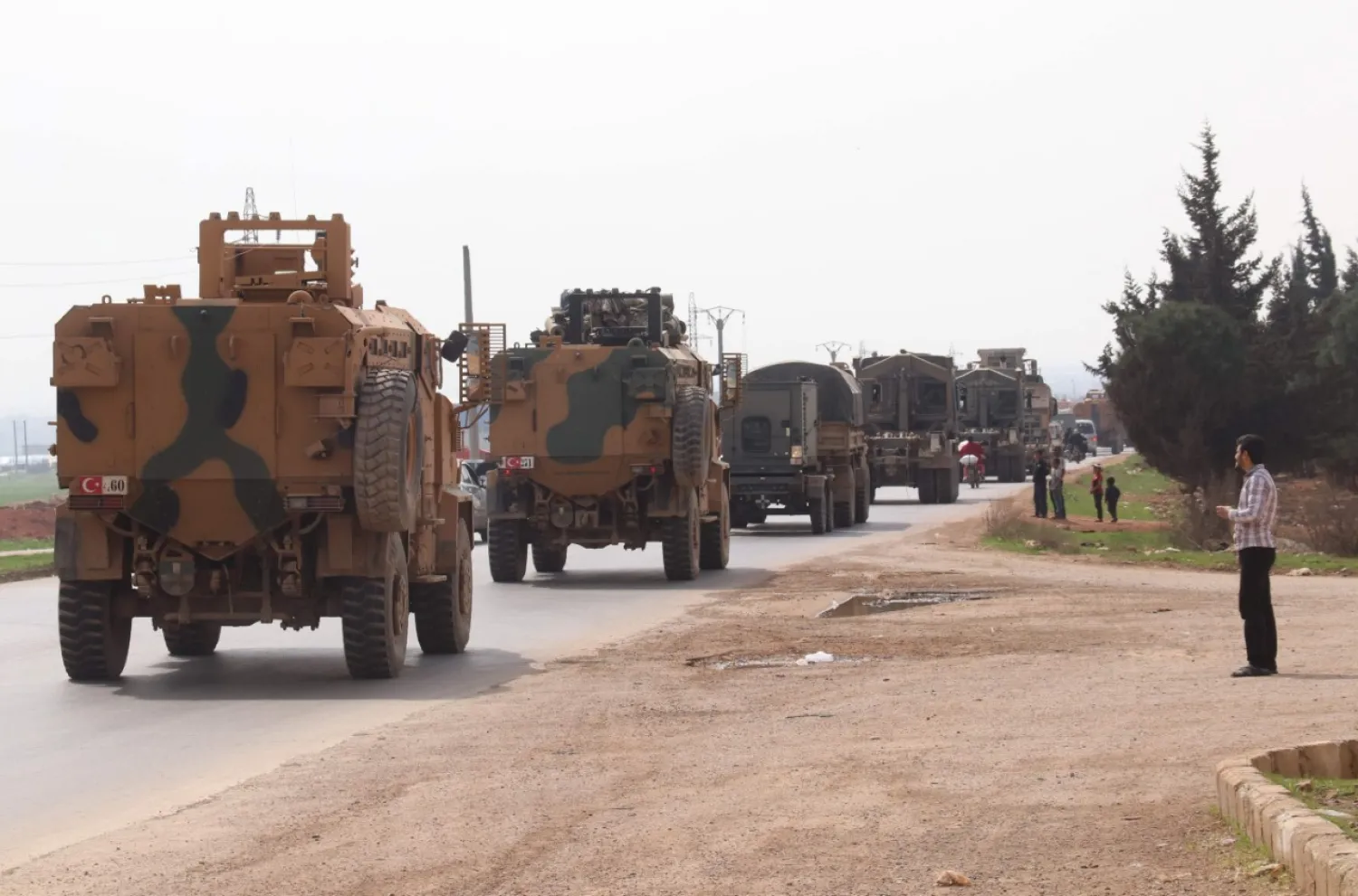 A Turkish convoy drives near the Syrian town of Kefraya on the highway linking the northwestern Syrian province of Idlib to the Bab al-Hawa border crossing, March 10, 2020. AFP