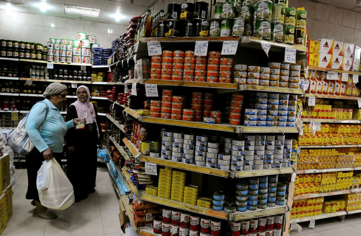 Two Egyptian women shopping in a supermarket in Cairo, Egypt, December 1, 2019. (Reuters)