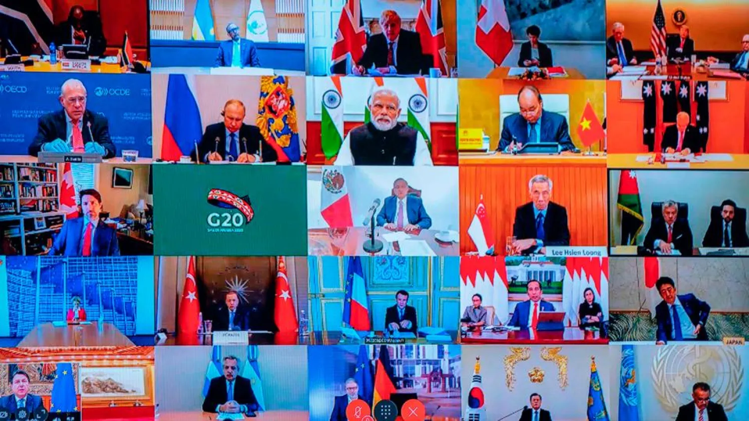 This photo of a television screen taken and handout by the press office of Palazzo Chigi on March 26, 2020 shows the G20 video conference. (AFP)