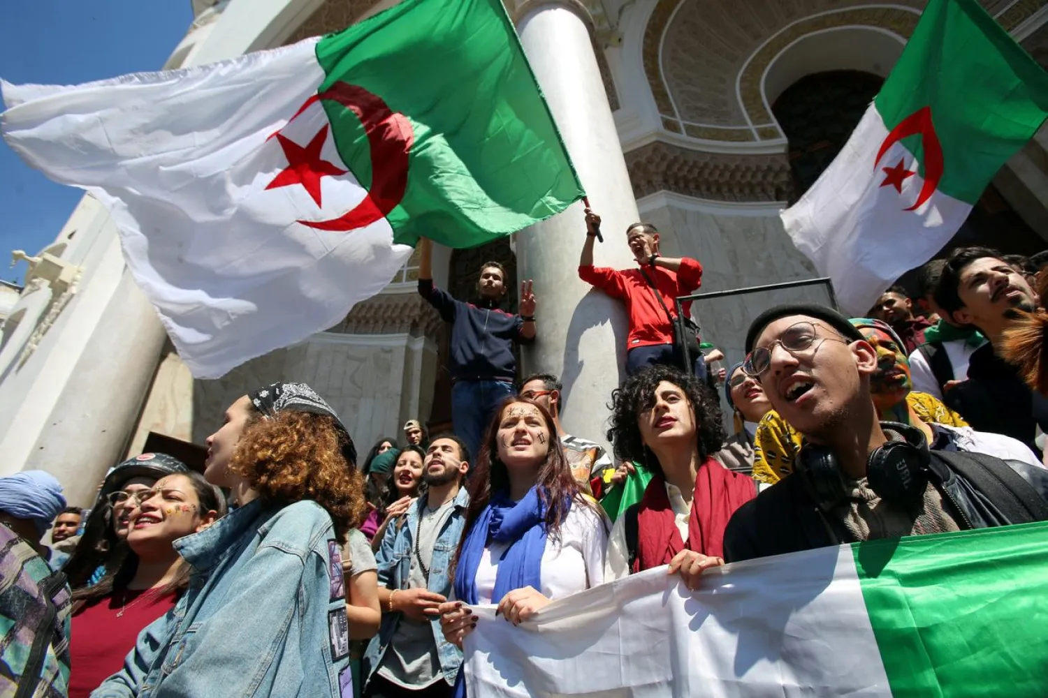 FILE PHOTO: Demonstrators hold flag during anti government protests in Algiers, Algeria April 23, 2019. REUTERS/Ramzi Boudina
