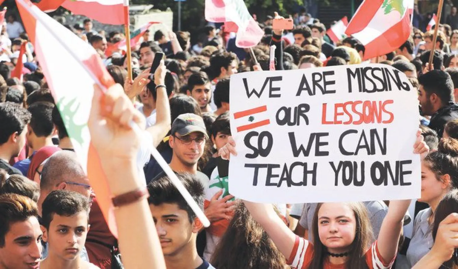 Lebanese students rally in front of the Ministry of Education during ongoing anti-government protests, in the capital Beirut. (AFP)
