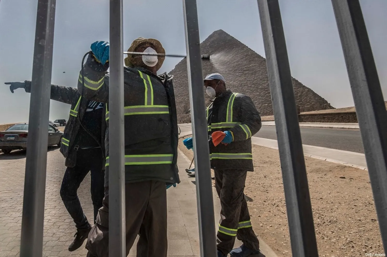 Egyptian municipality workers disinfect the Giza pyramids as protective a measure against the spread of the coronavirus on March 20, 2020. (Getty Images)