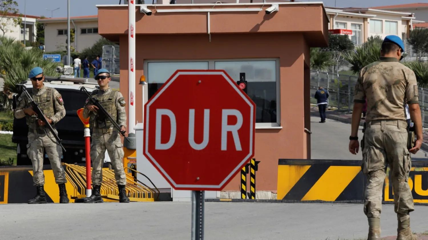Soldiers stand guard at the entrance to the Aliaga Prison and Courthouse complex in Izmir, Turkey, Oct. 12, 2018