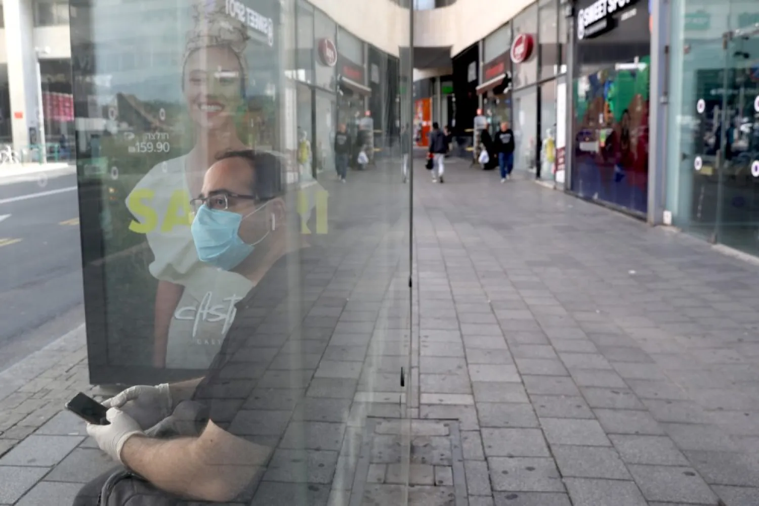 A man wearing a protective mask in a bus station in central Tel Aviv, Israel, 16 March 2020. (EPA)