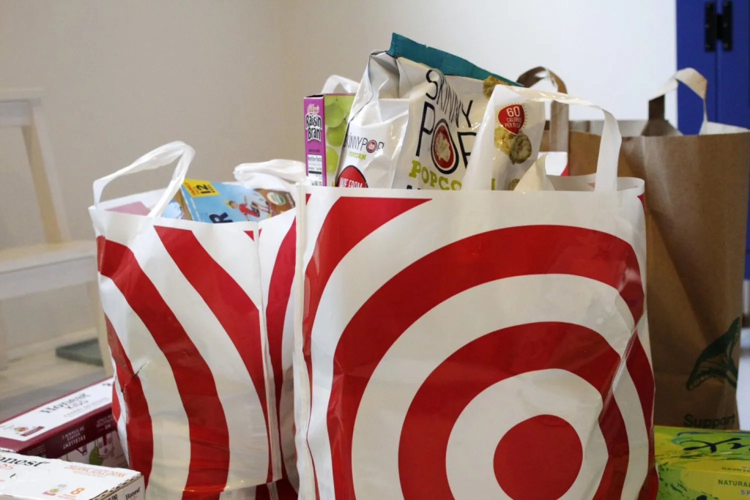 In this Sunday, March 29, 2020, photo, groceries loaded in plastic bags are seen after a shopping trip in Portland, Ore. (AP Photo/Gillian Flaccus)