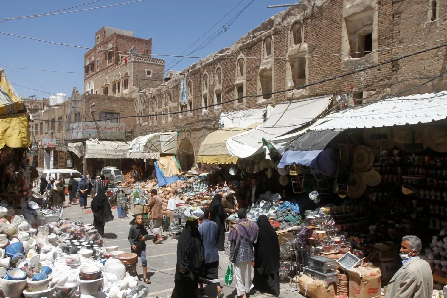 People shop at a market in the old quarter of Sanaa, Yemen April 9, 2020. (Reuters)