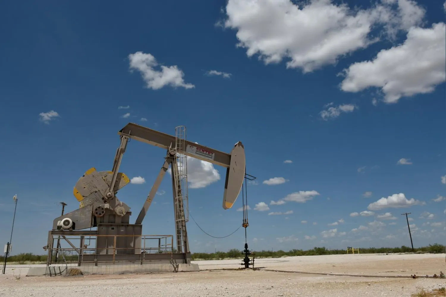 A pump jack operates in the Permian Basin oil production area near Wink, Texas, US, August 22, 2018. (Reuters)