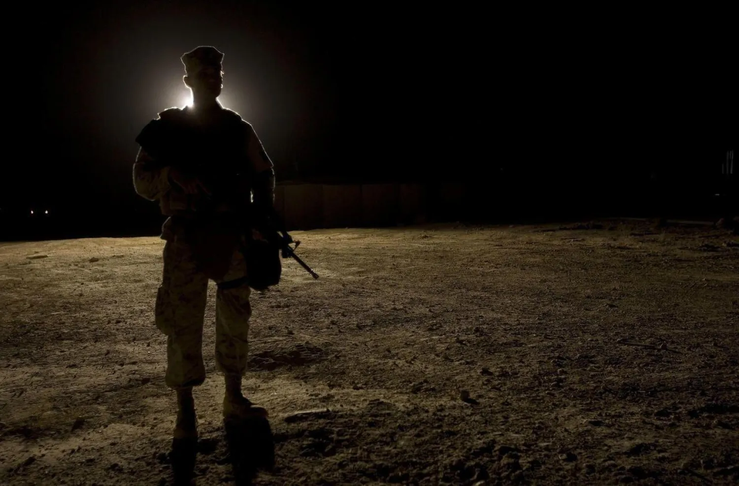 In this file photo taken on September 3, 2007 a US Marine stands guard as the US president visits Al-Asad Air Base in Anbar Province, Iraq. (Getty Images)
