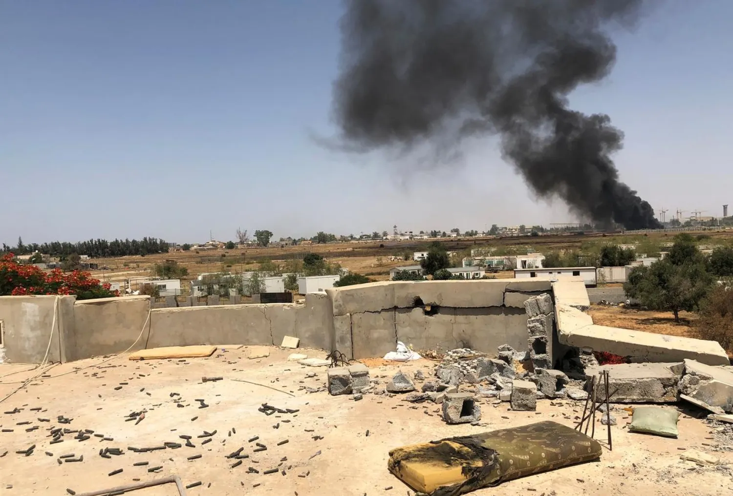 Smoke rises during a fight between members of the LNA and GNA in southern Tripoli, Libya June 22, 2019. (Reuters)