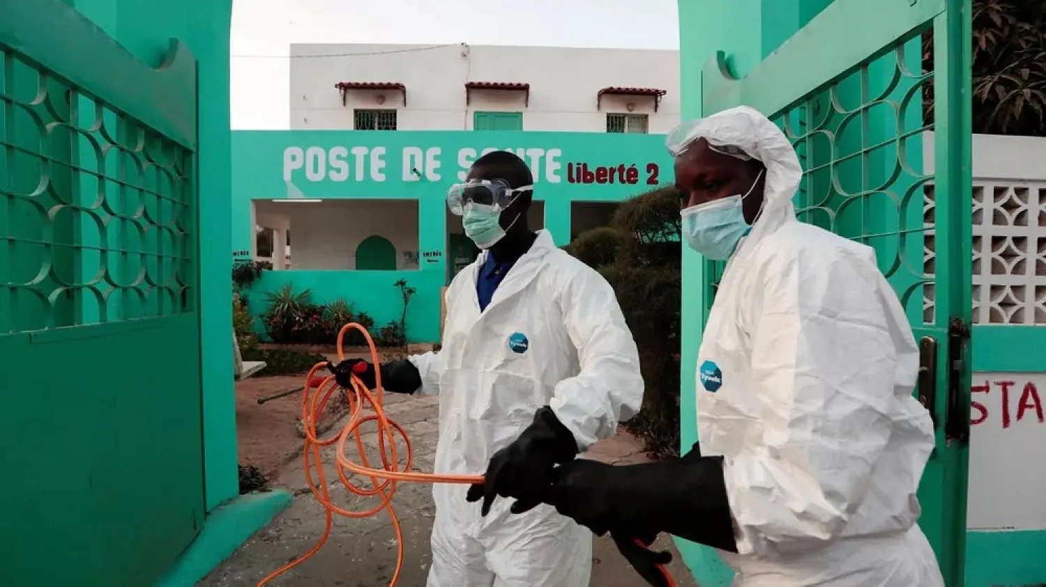 Members of local hygiene services prepare to disinfect a health centre to stop the spread of the coronavirus in Dakar, Senegal, on April 1. (Reuters)