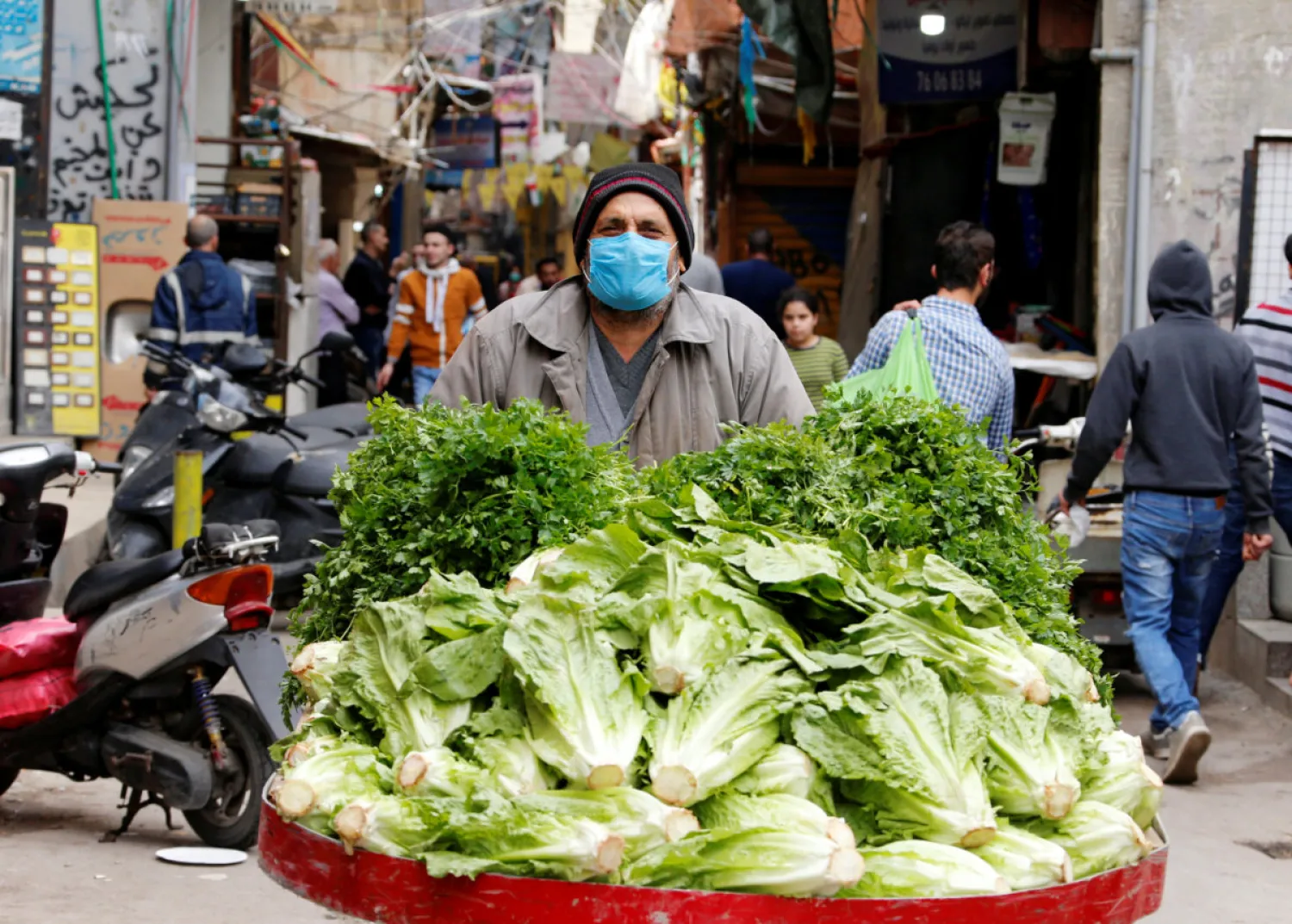 A street vendor pushes his cart in the Shatila Palestinian refugee camp in the Beirut suburbs. (Reuters)