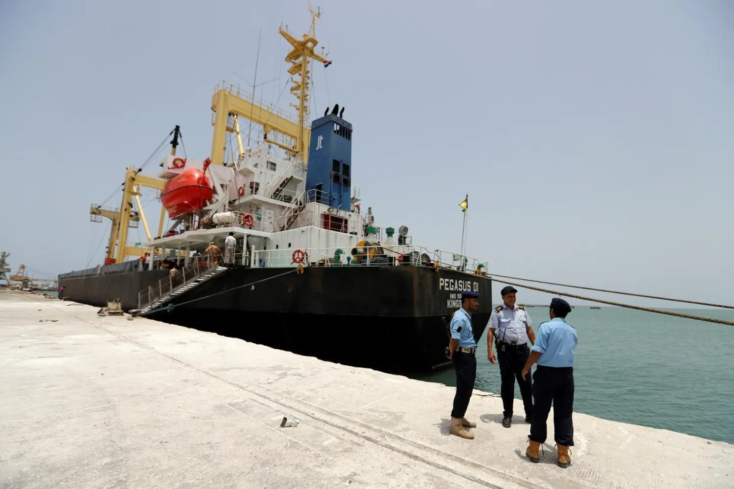 Yemeni local coast guards talk to each other after their deployment at Hodeidah port in Hodeidah, Yemen May 13, 2019. (Reuters)