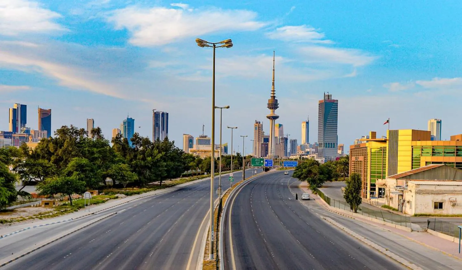 A view of an empty street with the Liberation Tower seen in the background, in Kuwait City. (EPA)
