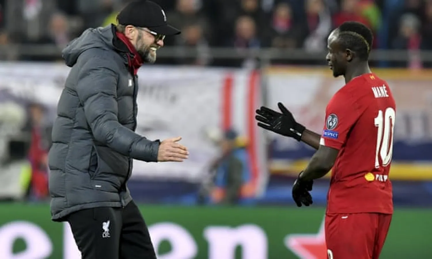  Jürgen Klopp shares his delight with Sadio Mané. Photograph: Kerstin Joensson/AP
