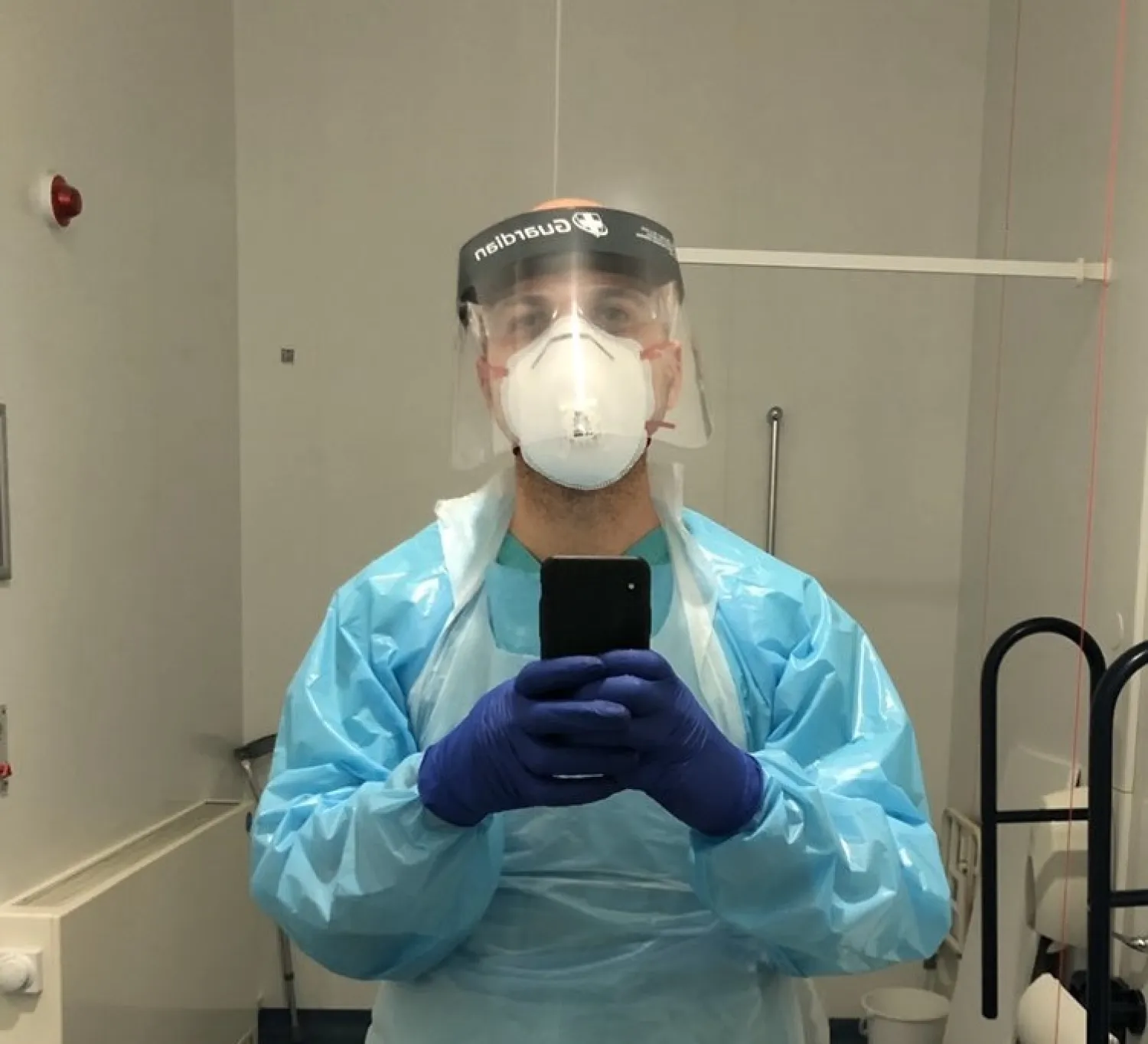Hassan Akkad takes a selfie as he works as a cleaner at the Whipps Cross University Hospital, amid the coronavirus outbreak in London, Britain April 7, 2020. (Hassan Akkad via Reuters)