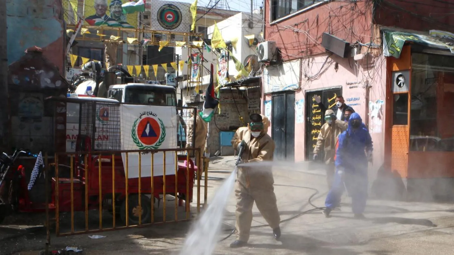 Workers disinfect the Wavel camp (also known as the Jalil Camp) for Palestinian refugees in Lebanon's eastern Bekaa Valley, on April 22, 2020. (Photo by AFP)