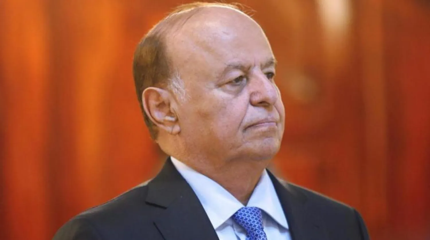 Yemeni President Abdrabbuh Mansour Hadi stands during a reception ceremony during the holy fasting month of Ramadan in this July 7, 2014 file photo. REUTERS/Khaled Abdullah/Files