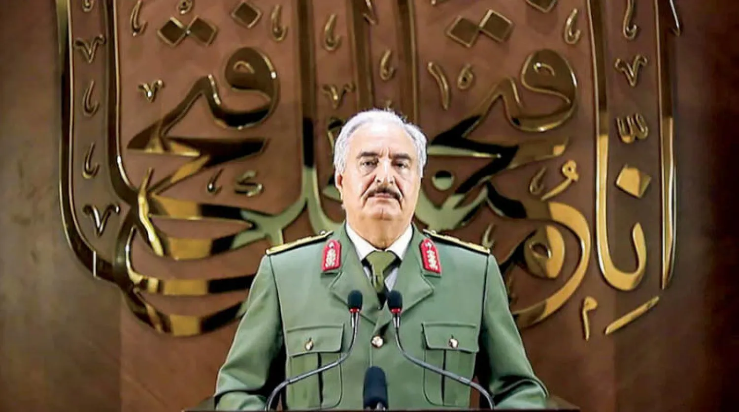 حفتر خلال إعلانه في كلمة متلفزة مساء أول من أمس {قبوله} تولي زمام السلطة في ليبيا (أ.ف.ب)