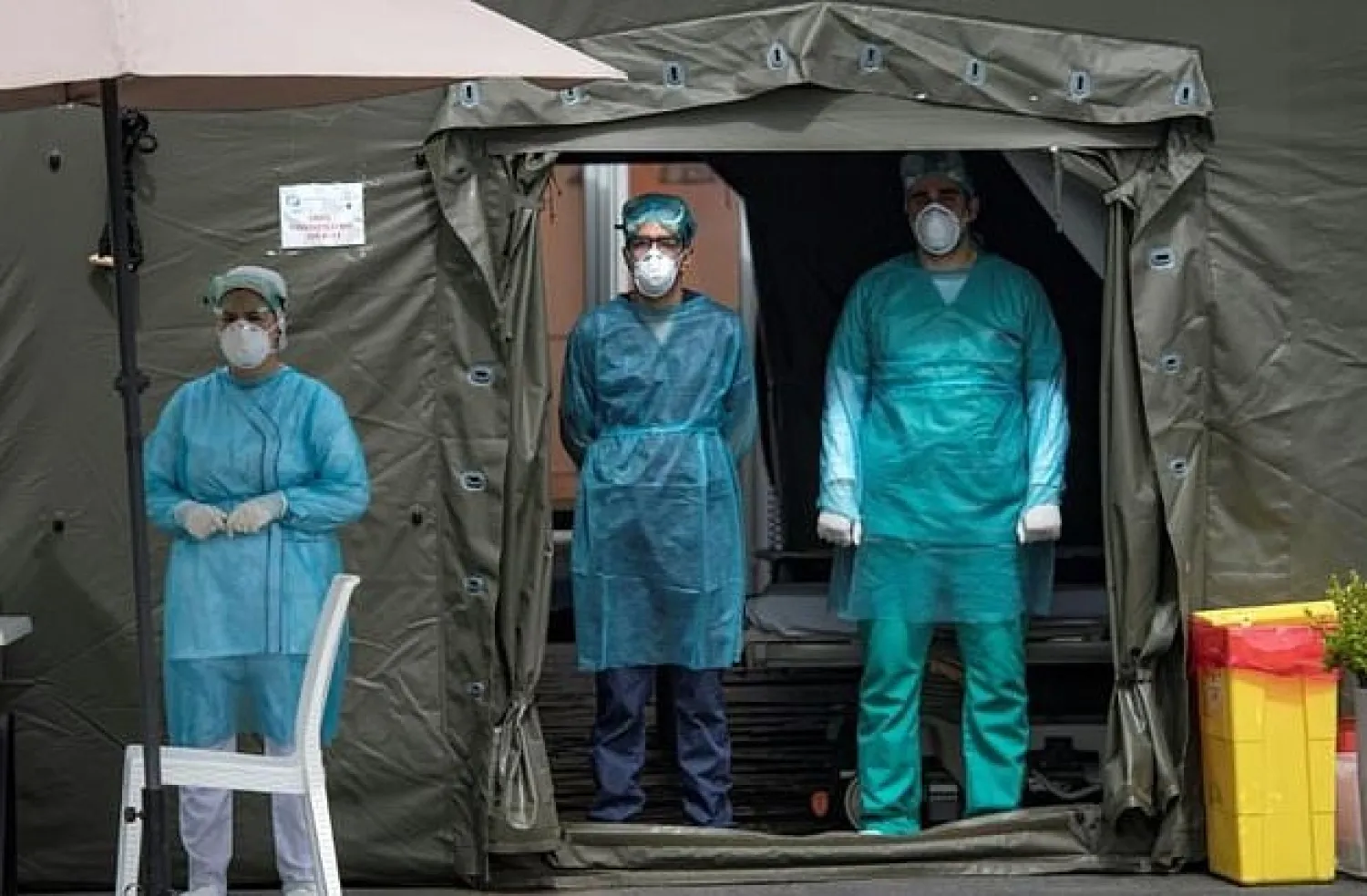 Medical staff at Mohammmed V military hospital wear protective masks and caps as they wait for patients in the Moroccan capital Rabat. AFP