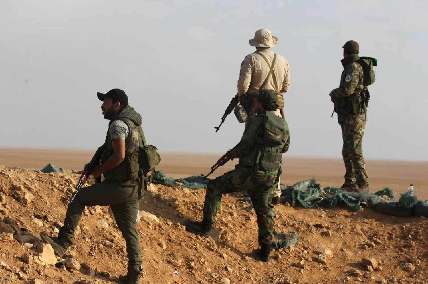 Fighters from the Popular Mobilization Forces secure the Iraqi-Syrian border in al-Qaim in Anbar province in Iraq | AFP