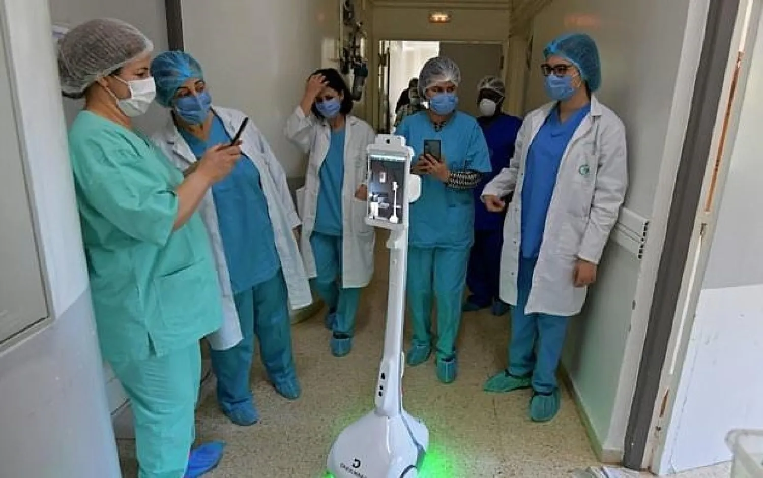The robot helps medics and relatives maintain virtual contact with patients and avoids the risk of infection. AFP