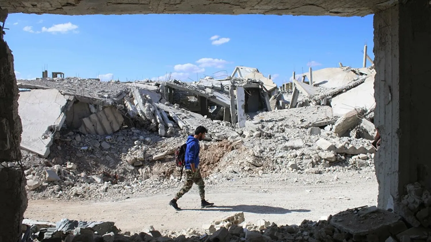 A man walks past destroyed buildings in a the southern city of Daraa, Syria, Nov. 6, 2017. (Getty Images)