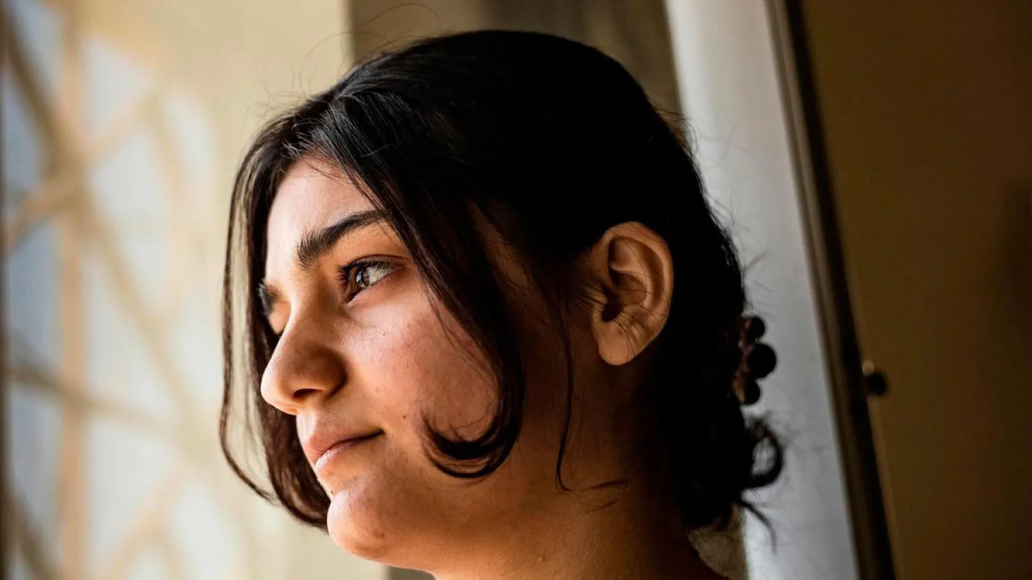 Layla Eido, a teenager from Iraq's minority Yazidi community, is pictured in the countryside of Syria's northeastern province of Hasakeh on April 23, 2020. AFP
