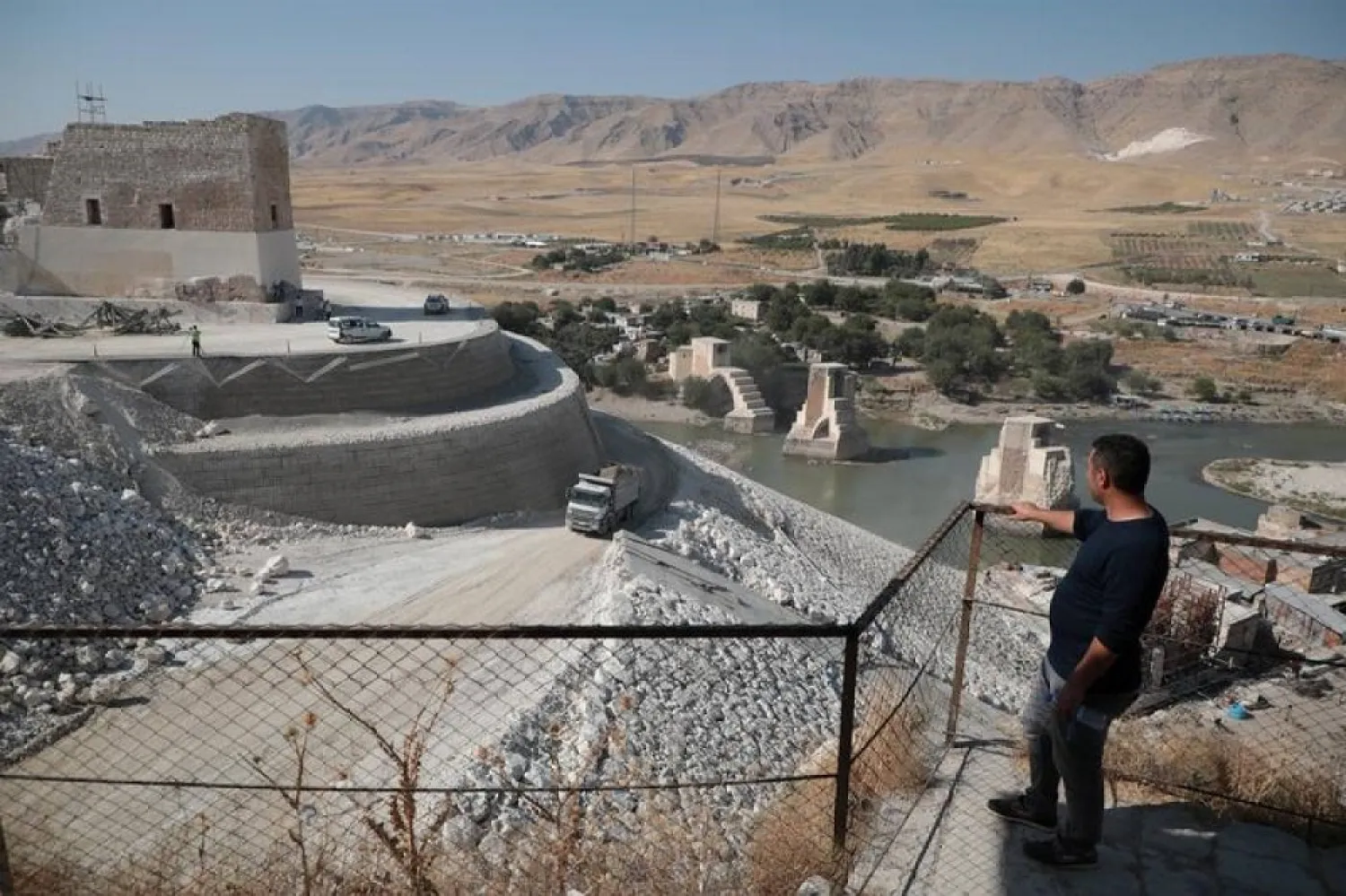 A man stands overlooking Hasankeyf, which will be significantly submerged by the Ilisu Dam, in southeastern Turkey, October 3, 2019. (Reuters)