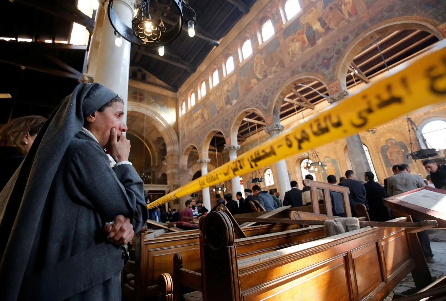 A nun surveys the aftermath of an attack on Cairo's Coptic cathedral (File photo: Reuters)