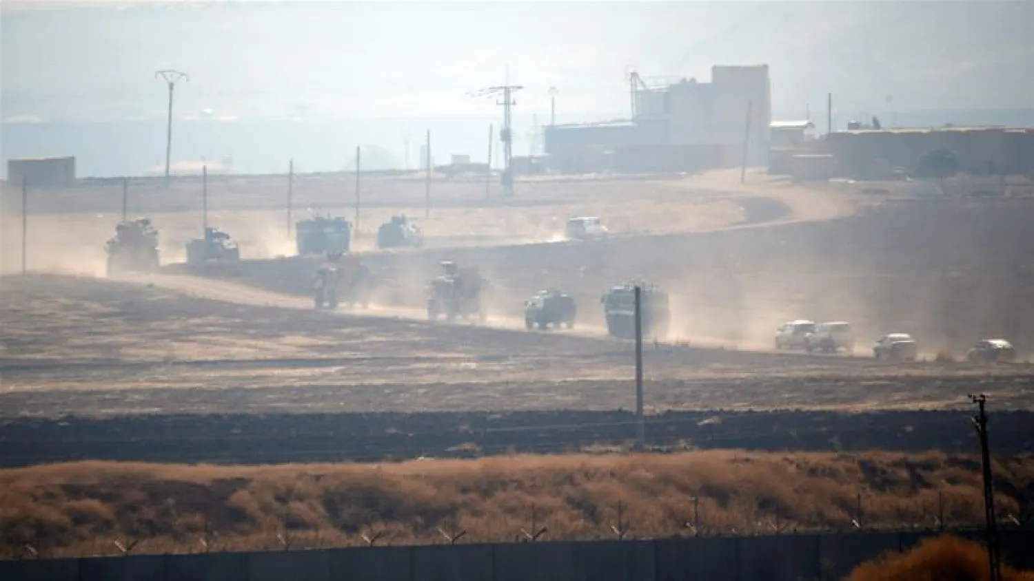 Turkish armored vehicles on Friday drove through country roads across the border to join the Russians [Kemal Aslan/Reuters] 