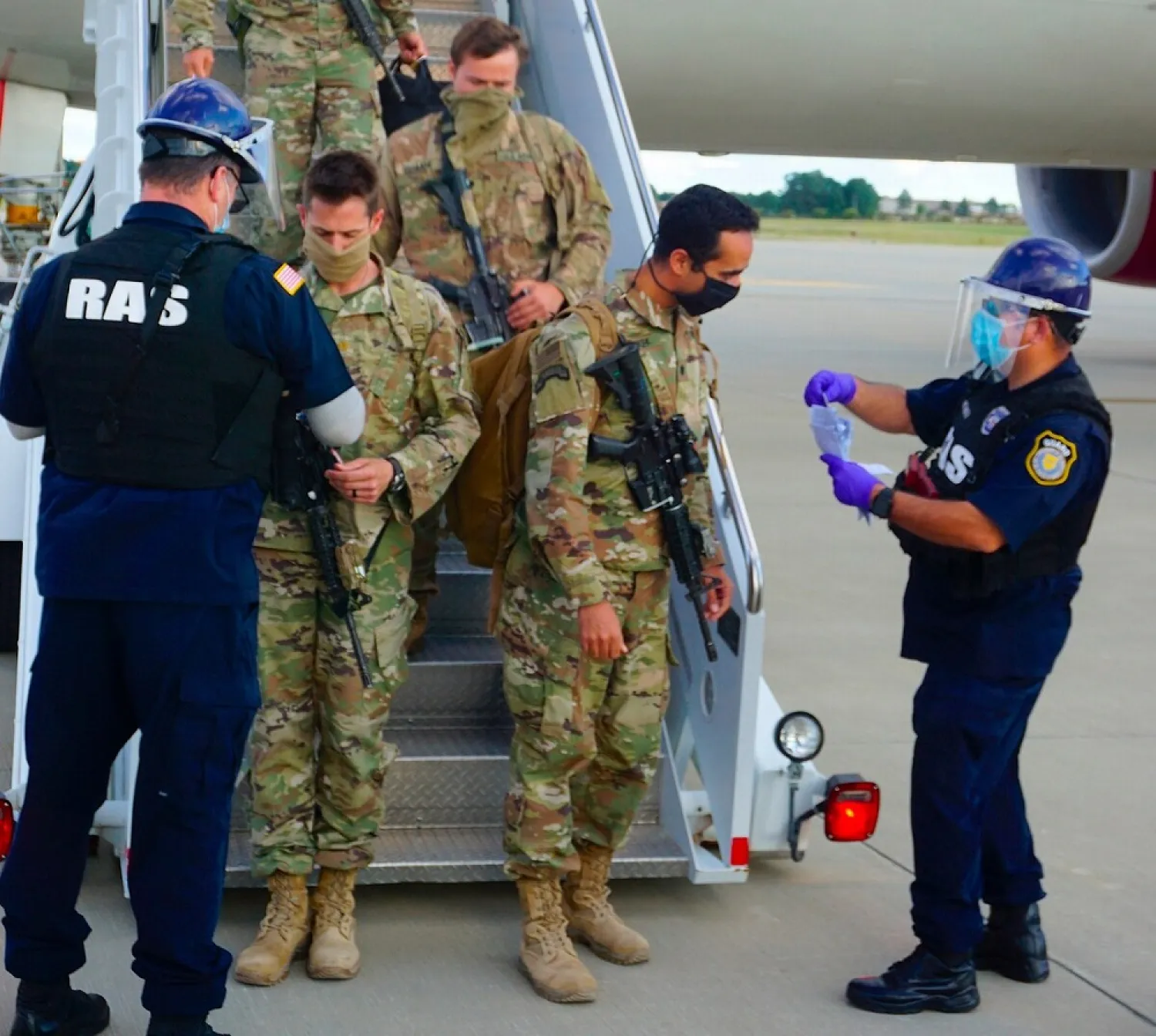 Paratroopers assigned to Fort Bragg's 82nd Airborne Division return at Pope Army Airfield, Friday, May 1, 2020.  (US Army via AP)