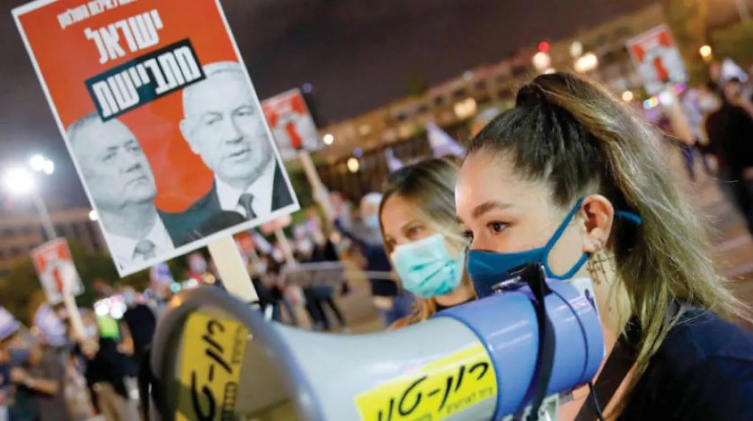 Geçtiğimiz hafta Tel Aviv’de koalisyon hükümetine karşı yapılan göstericiler.  (AFP)