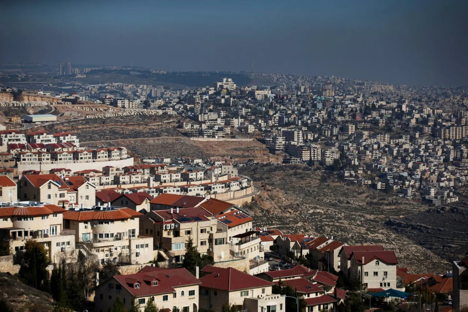A general view picture shows the Israeli settlement of Efrat (L) in the Gush Etzion settlement block as Bethlehem is seen in the background, in the Israeli-occupied West Bank January 28, 2020. (Reuters)