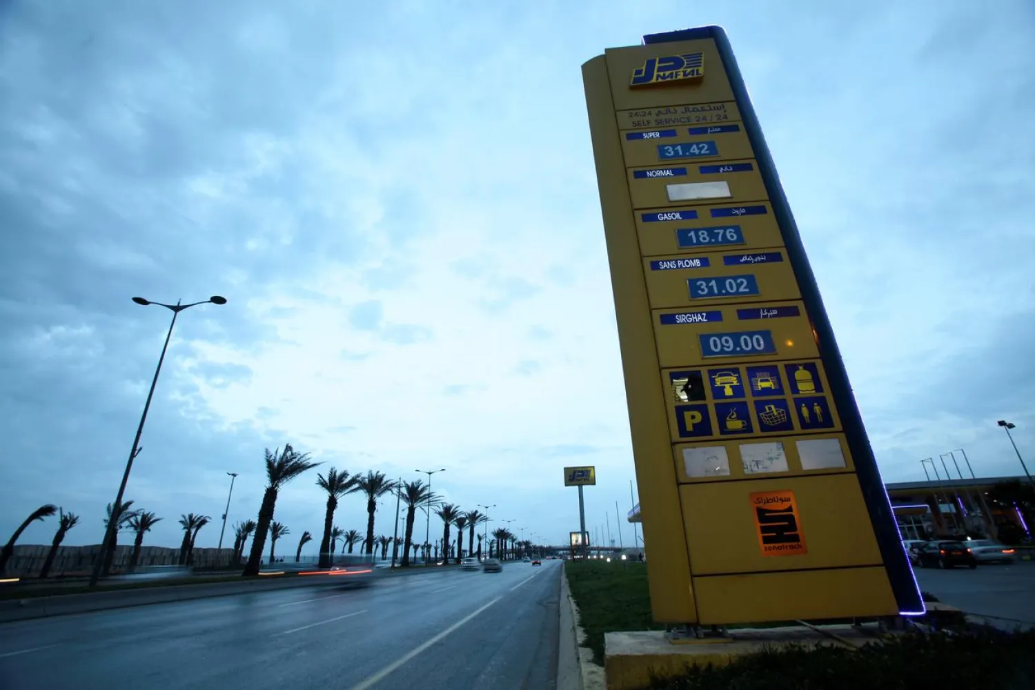 A Naftal billboard shows prices at the entrance of the fuel station in the highway of Algiers, Algeria February 3, 2016. (Reuters)