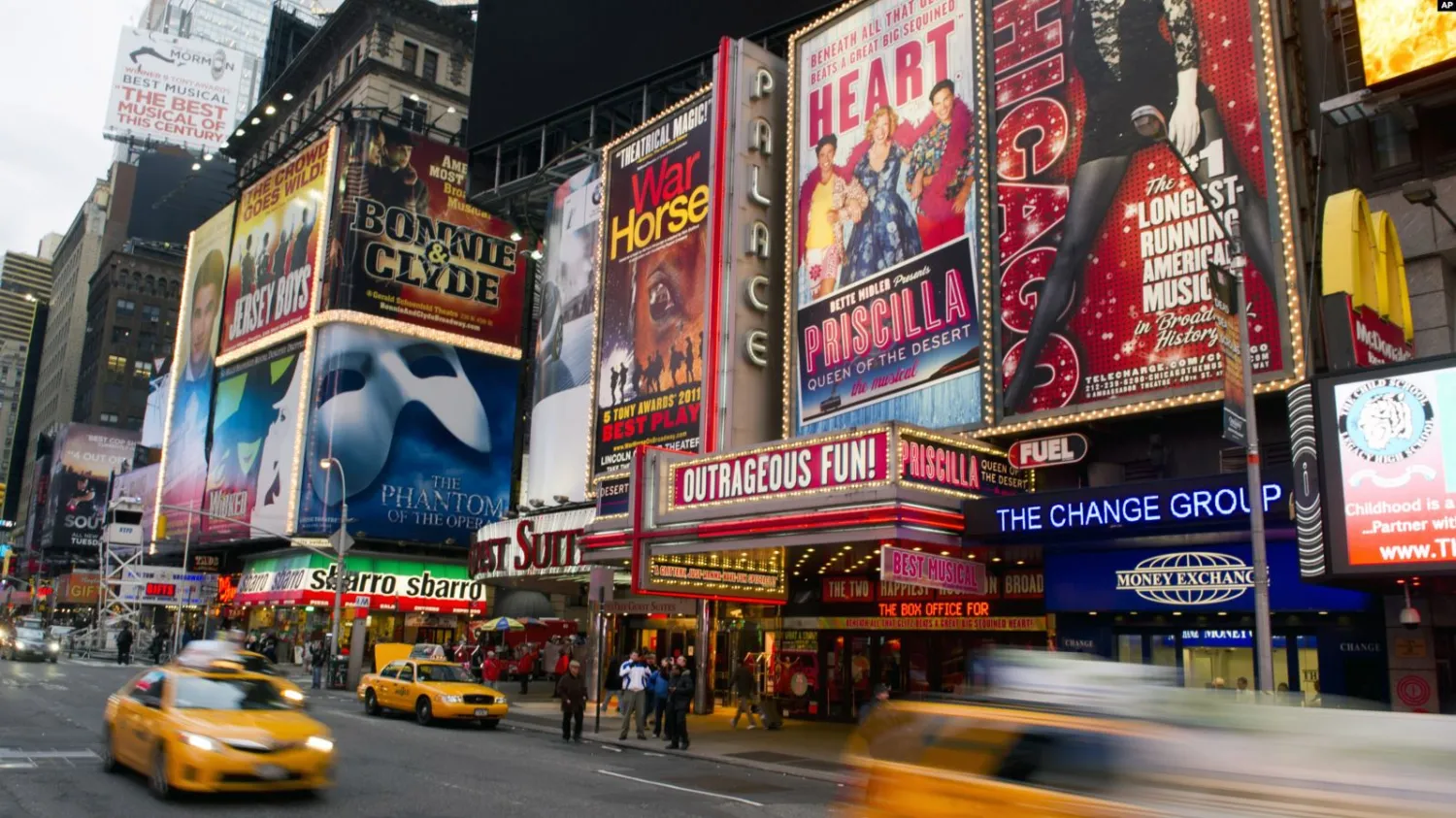 This Jan. 19, 2012 file photo shows billboards
advertising Broadway shows in Times Square, in New York. (AP
Photo/Charles Sykes, file)
