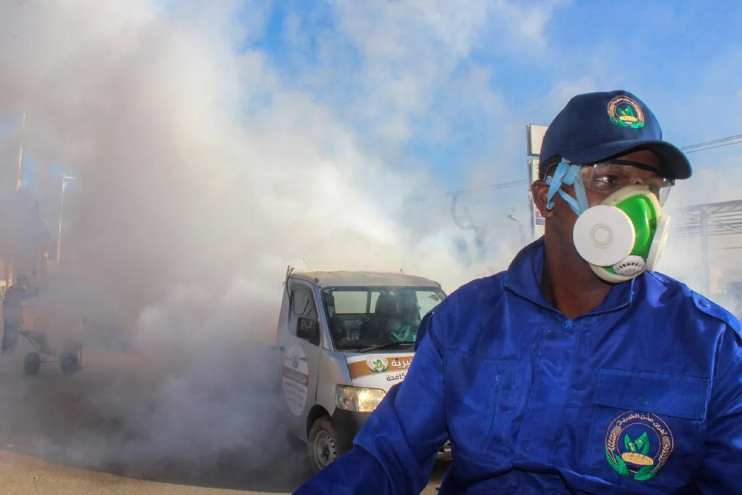 A sanitary worker performs a fumigation in Aden, Yemen to prevent insect-borne diseases amid the coronavirus pandemic. (AFP)
