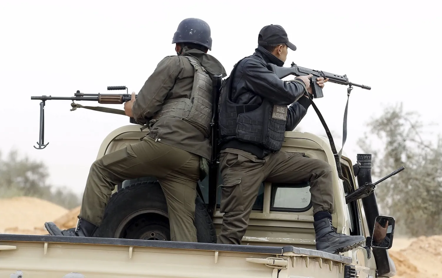 Tunisian policemen patrol during a military operation to eliminate militants near the Libyan border. (Reuters)