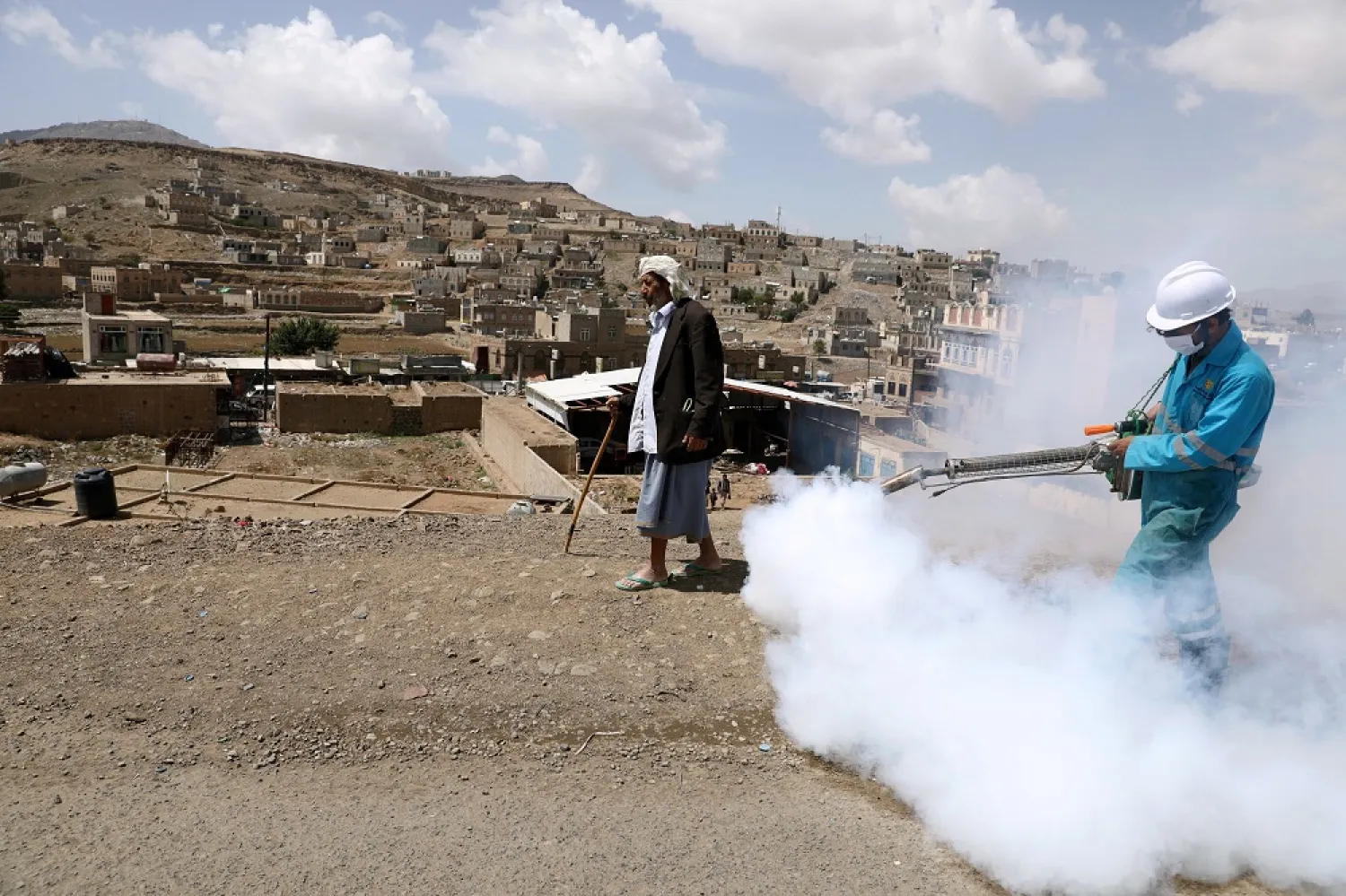 A health worker disinfects residential area during a sanitation campaign to prevent the spread of the coronavirus, on the outskirts of Sanaa, Yemen April 13, 2020. (Reuters)