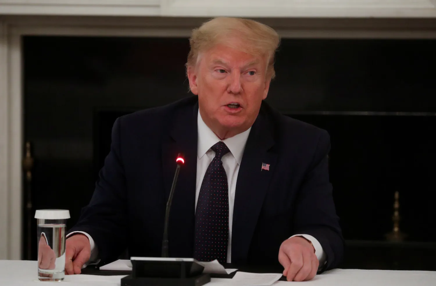 US President Donald Trump speaks with restaurant executives and industry leaders during a coronavirus disease (COVID-19) pandemic meeting in the State Dining Room at the White House in Washington, US, May 18, 2020. REUTERS/Leah Millis