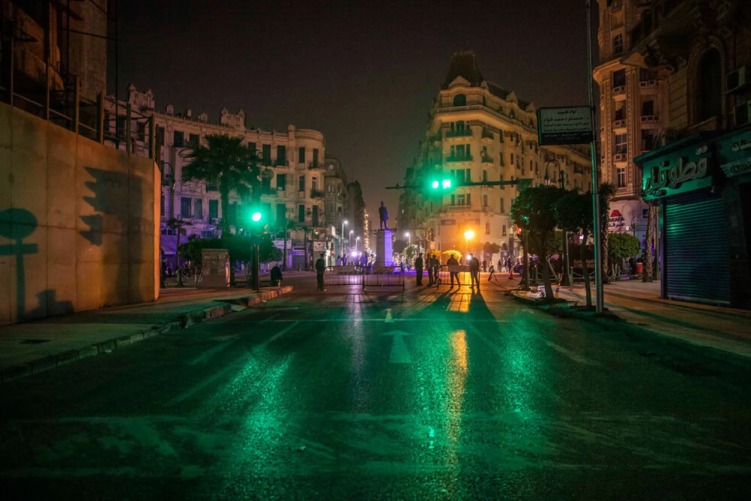 Egyptian security forces cordon off roads during curfew hours as prevention measures due to the coronavirus outbreak, in Cairo, Egypt. (AP)