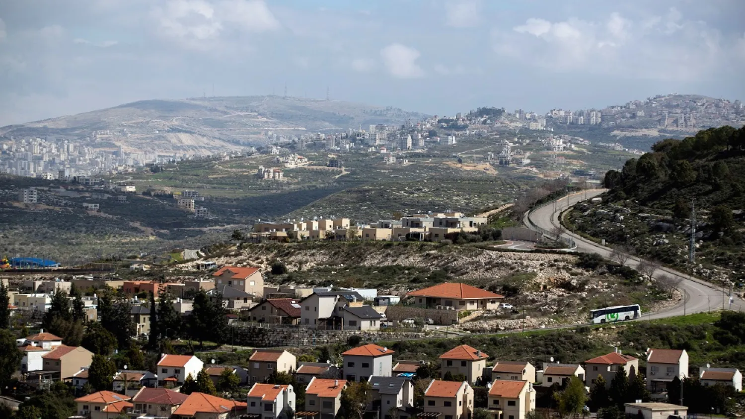 Houses in the Israeli settlement of Kedumim are seen in the foreground as part of the Palestinian city of Nablus is seen in the background (far left) in the West Bank, Feb. 20, 2020. (Reuters)