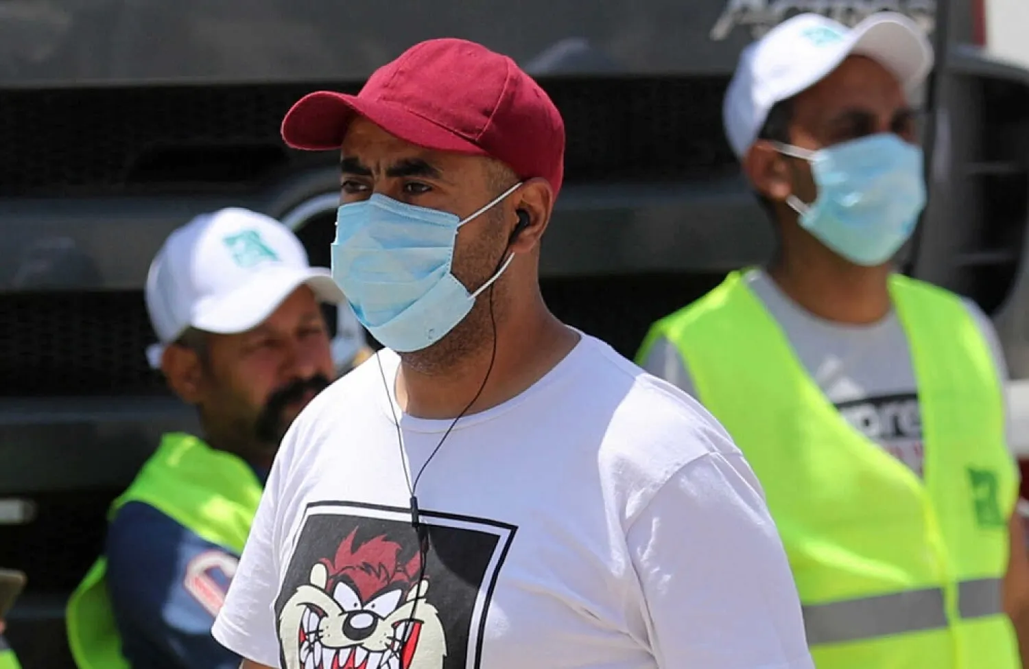 Men wearing protective face masks are seen in downtown Cairo, Egypt, amid concerns about the spread of the coronavirus disease (COVID-19), May 2, 2020. (Reuters)