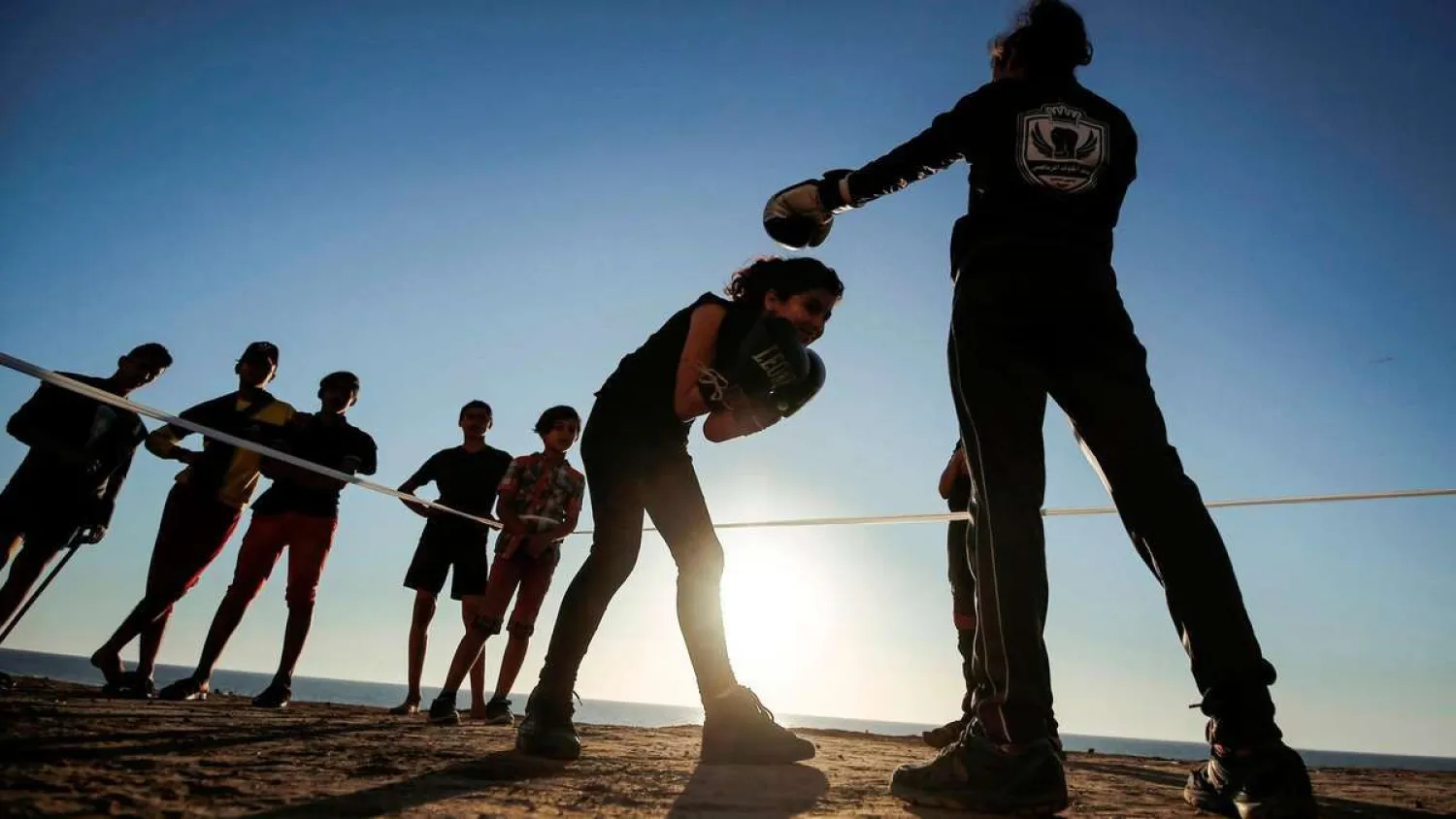 Palestinian girls take part in an open-air boxing training near the beach in Gaza City. (AFP)