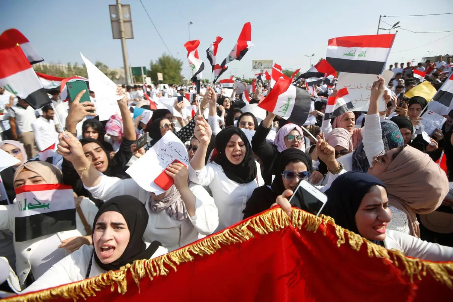 School students chant slogans as they take part in a protest over corruption, lack of jobs, and poor services, near the Governorate building in Basra, Iraq, October 28, 2019. REUTERS/Essam al-Sudani