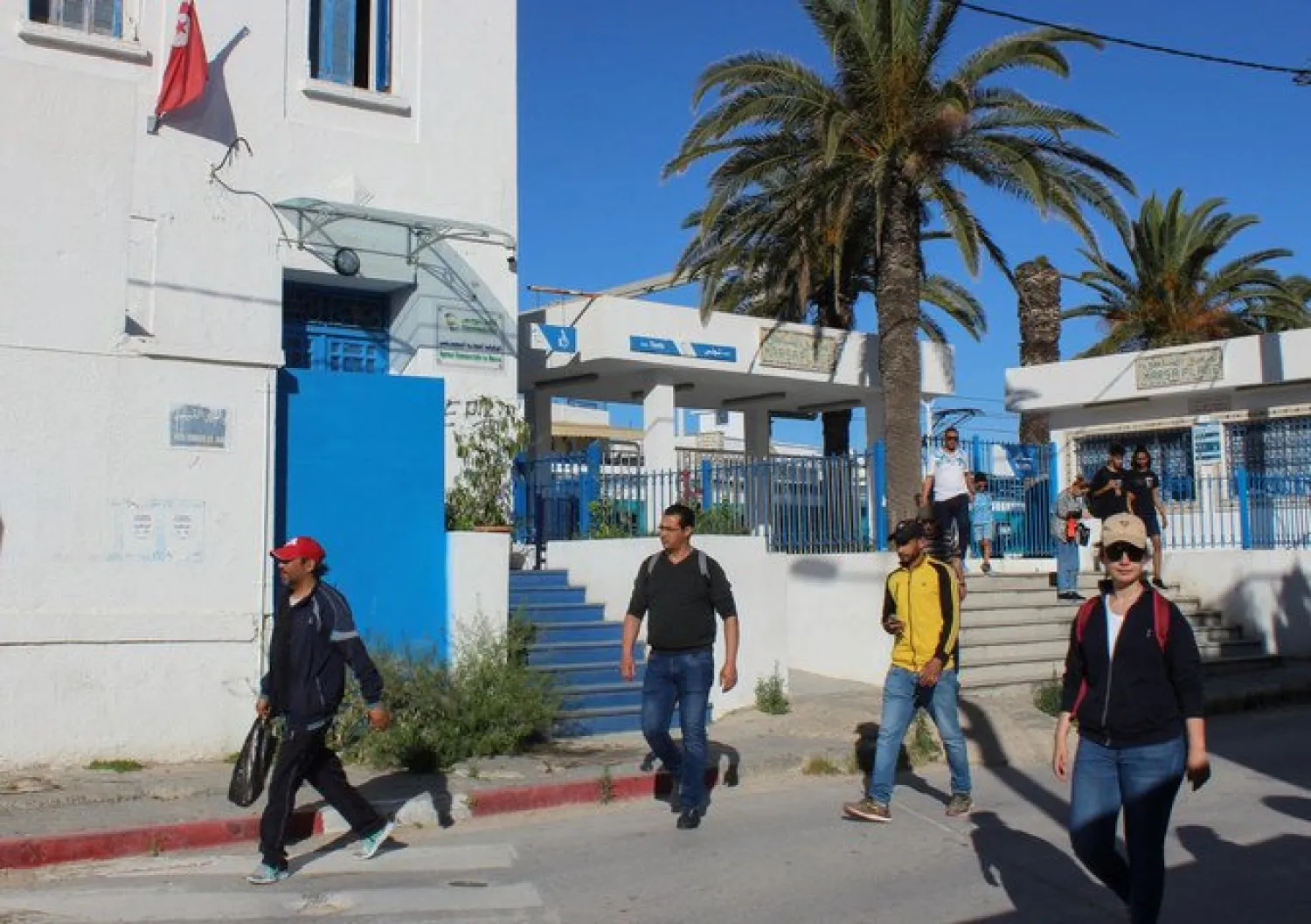 People leave a train station, as Tunisia relaxes some of its lockdown rules . Reuters file photo