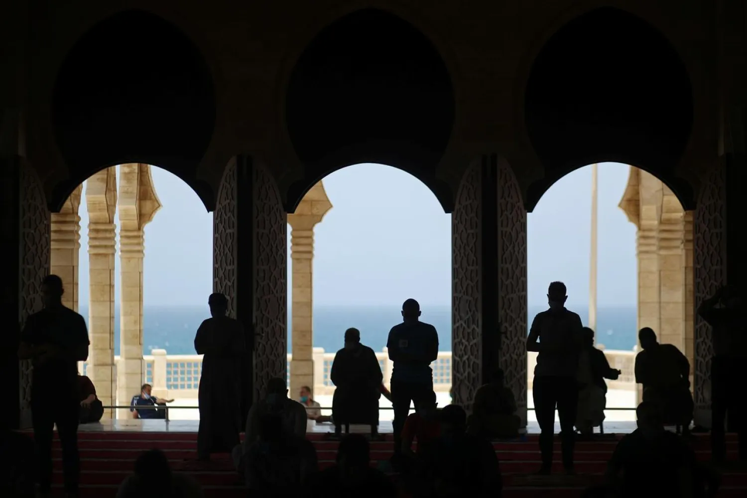 Palestinians maintaining social distancing attend Friday prayers in a mosque, amid concern about the spread of COVID-19, in the northern Gaza Strip May 22, 2020. (Reuters)