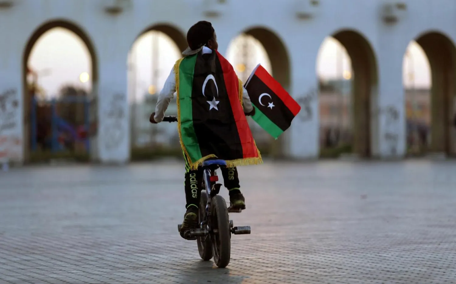 A boy wearing a Libyan flag takes part in a celebration marking the sixth anniversary of the Libyan revolution, in Benghazi, Libya February 17, 2017. (Reuters)