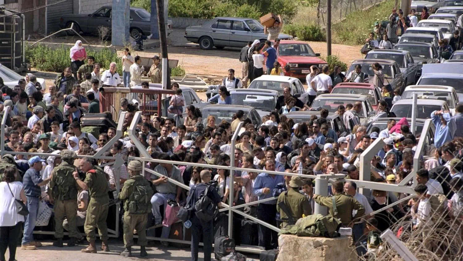Lebanese refugees, many of them relatives of fighters with the South Lebanon Army, wait to enter Israel after the Israeli withdrawal from Lebanon on May 23, 2000. (Getty Images)