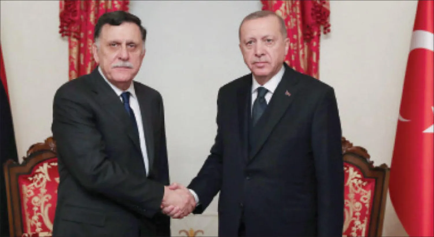 السراج وإردوغان خلال لقائهما بإسطنبول في فبراير الماضي (أ.ف.ب)