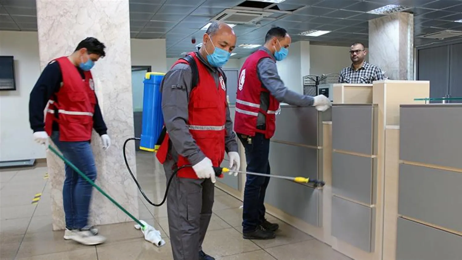 Employees to help limit the spread of the coronavirus, Tripoli, Libya  (File photo: Reuters)
